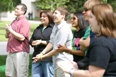 A crowd of supportive students gather to cheer for their fellow classmates.