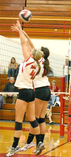 Brookey Holmes(left) and Maddie Dahl(right) attempt to block the ball against Citrus on Oct. 30.