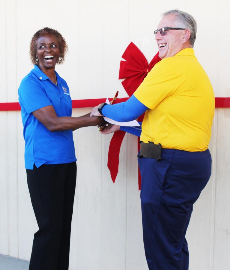 Fuchsia Ward and Fred Kittredge smile before the cutting of the ribbon.