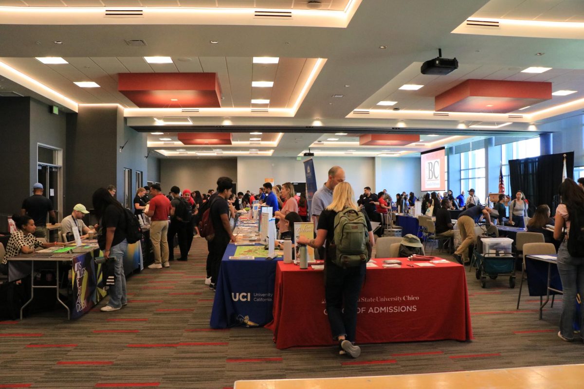 Students discussing opportunities with several universities at the Renegade Events Center 