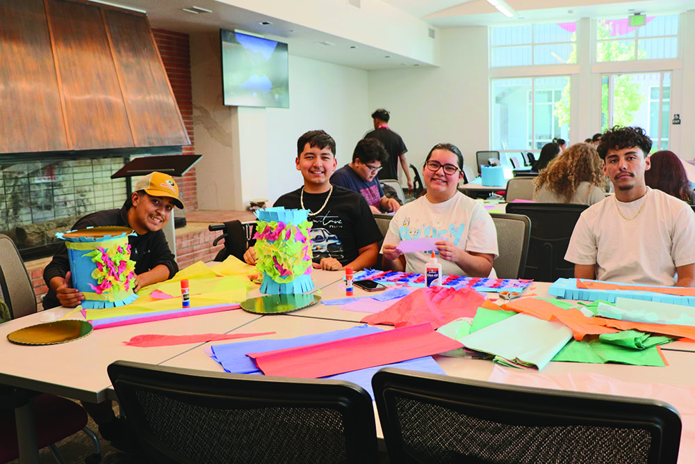 Bright smiles along with BC students having a enjoyable time at the piñata creating event. 