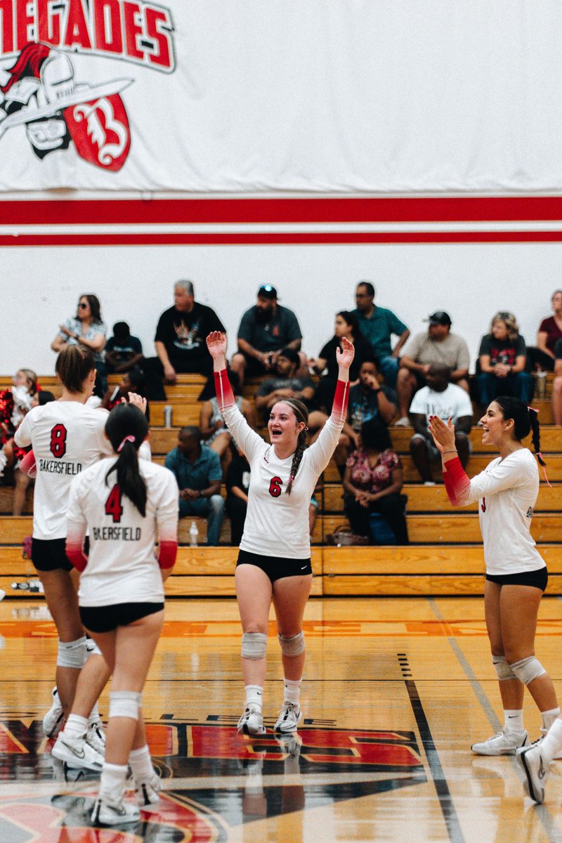 BC Setter Chloe Comstock (6) celebrates with Jillian Holcombe (4) and Amanda Zepeda (3) after Alexandra Watts (8) gets a kill vs. West LA.